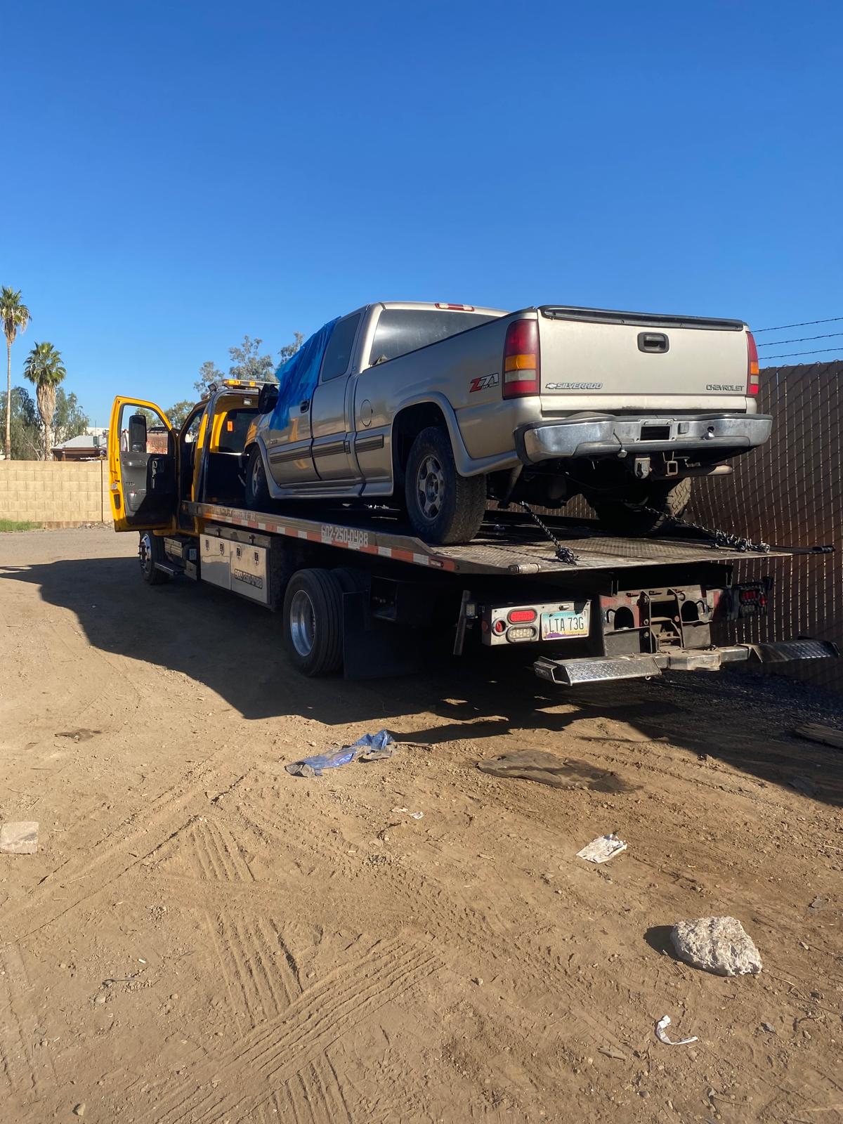 Pickup truck safely secured on Keep Going flatbed